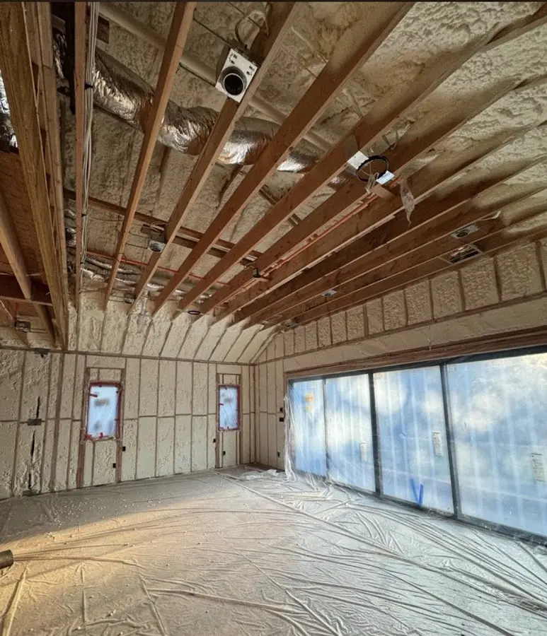 Interior walls and ceiling insulated with spray foam during new construction in Firebaugh